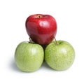 One red and three green apples in piramid Royalty Free Stock Photo