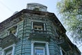 Old open balcony on a green wall with windows Royalty Free Stock Photo