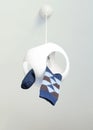 One rhombus checkered sock hanging from a ceiling chandelier. National Lost Sock Memorial Day Concept.