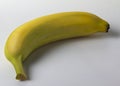 One ripe little banana on a white background