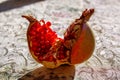 One ripe opened pomegranate fruit closeup