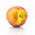 One ripe peach on a white background Royalty Free Stock Photo