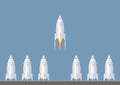 One rocket launching amongst the others. Start up and leadership business concept