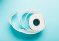 One roll of white toilet paper on a blue background