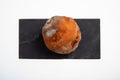 One rotting and moldy orange fruit with black and white spots isolated on white Royalty Free Stock Photo