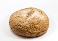 One round grain bread isolated on a white background.Whole fresh wheat and rye small bread with a lot of seeds