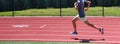 One runner running fast on the turn of a track Royalty Free Stock Photo