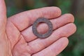 One rusty brown old iron washer rests