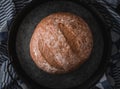 One rye round bread on a black background. Royalty Free Stock Photo