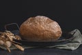 One rye round bread on a black background. Royalty Free Stock Photo