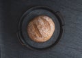 One rye round bread on a black background. Royalty Free Stock Photo