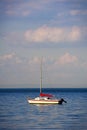 One Sailboat Moored at Sea Royalty Free Stock Photo