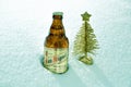 San Miguel beer bottle and christmas tree in snow