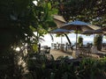 One of Sanur Restaurant Beach side view, surrounding tree and plants in the morning. Travel destination. Sanur Beach, Bali Royalty Free Stock Photo