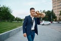 One saxophonist with sax, buildings on background Royalty Free Stock Photo