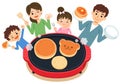 A pancake party on a hot plate, a scene of a family meal.