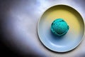 One scoop of ice cream in a colored plate. AI generative