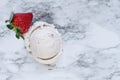 One Scoop of Strawberry Ice Cream with Single Strawberry Royalty Free Stock Photo