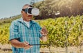 One senior mixed race farmer using virtual reality headset and digital tablet. Hispanic elderly man using technology to