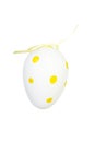 One separated white eggs in yellow dots decoration.