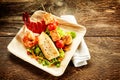 One serving of roasted seafood salad on plate