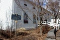 Large storefront with historic sign at edge of property, Woodstock, New York, 2019