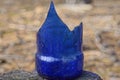 one sharp blue piece of a broken glass bottle Royalty Free Stock Photo