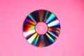 One shiny compact disc on pink background, top view Royalty Free Stock Photo