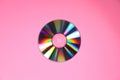 One shiny compact disc on pink background, top view Royalty Free Stock Photo