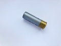 One shotgun cartridge on a white background