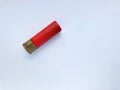 One shotgun cartridge on a white background