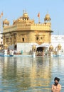 One Sihk Man Washing his Body in the golden temple. Royalty Free Stock Photo