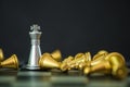 One silver king chess standing and outstanding among the collapse of fall golden chess