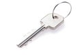 one simple silver metal key with ring isolated on white background, neural network generated image Royalty Free Stock Photo