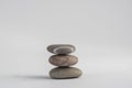 One simplicity stones cairn isolated on white background, group of light three gray white pebbles built in tower Royalty Free Stock Photo