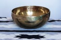 One singing Tibetan brass bowl for relaxation and meditation.