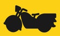 One single cruiser type motorcycle silhouette against a yellow backdrop Royalty Free Stock Photo
