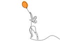 One single line drawing of a cute boy holding a balloon. Happy little child playing air balloon in the playground while jump hand Royalty Free Stock Photo