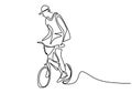 One single line drawing of young bicycle rider performing freestyle stand on a bicycle and hands free. Extreme sport concept.