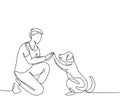 One single line drawing of young happy boy giving high five gesture to his puppy dog at outfield park. Pet care and friendship