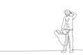 One single line drawing of young happy male guitarist standing and holding acoustic guitar case. Dynamic musician artist concept