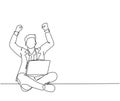 One single line drawing of young happy male manager sitting on floor and clenched fist raise in the air while on a laptop. Success