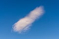Single white cloud against a clear blue summer sky Royalty Free Stock Photo