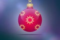 One single red hanging christmas tree ball with yellow and golden stars ornaments on a blue pink bokeh background with lens flare Royalty Free Stock Photo