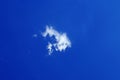 one single small fluffy white cloud Royalty Free Stock Photo
