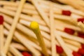 Yellow tipped match with red tipped matches Royalty Free Stock Photo