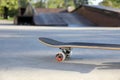 One skateboard with black griptape in modern skatepark Royalty Free Stock Photo