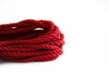 One skein of jute rope six millimeters for Japanese bondage and shibari, painted in red on a white background. Royalty Free Stock Photo