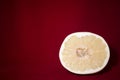 One slice of pomelo on a red table Royalty Free Stock Photo