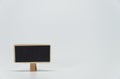 One small black board with white background and selective focus Royalty Free Stock Photo